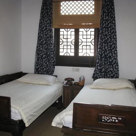 Yi (Anhui) XI Di Travel Lodge חדר תמונה