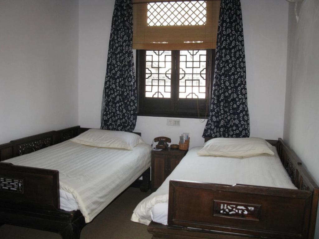 Yi (Anhui) XI Di Travel Lodge חדר תמונה